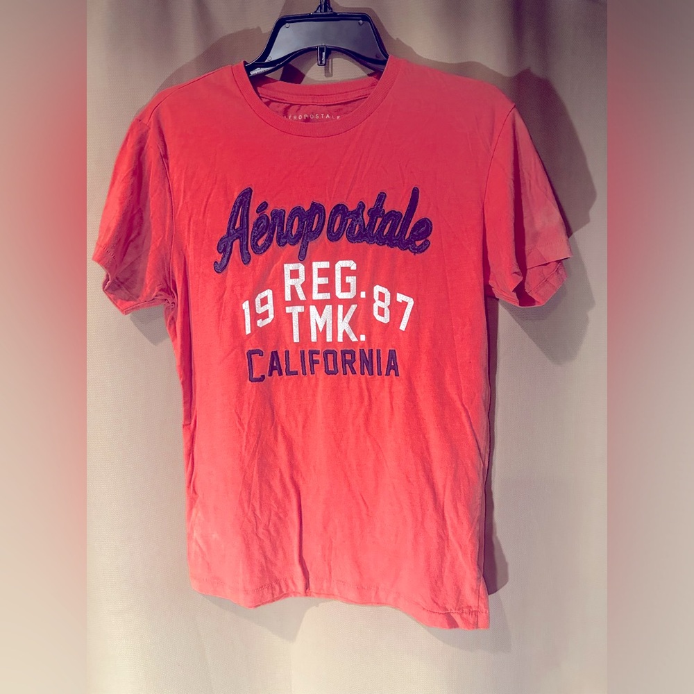 Small woman’s 1987 peach Aeropostale